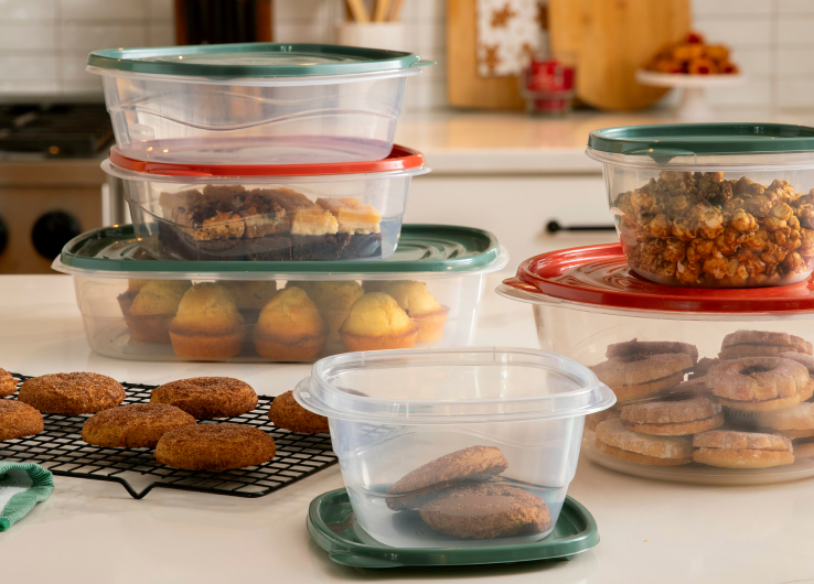 Holiday food storage containers filled with cookies, muffins and snacks