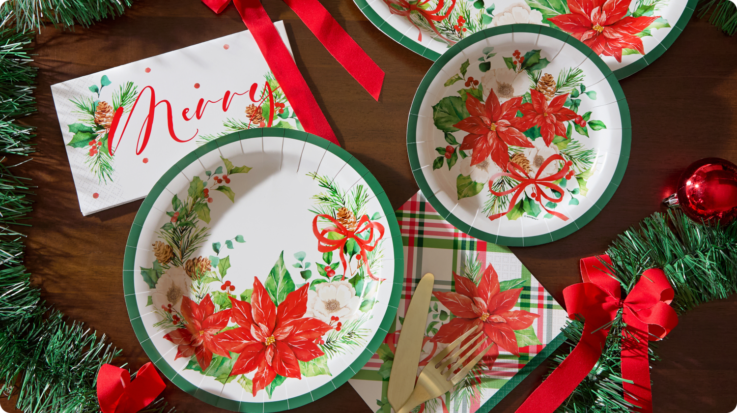 Holiday entertaining essentials featuring festive paper plates, napkins and tableware