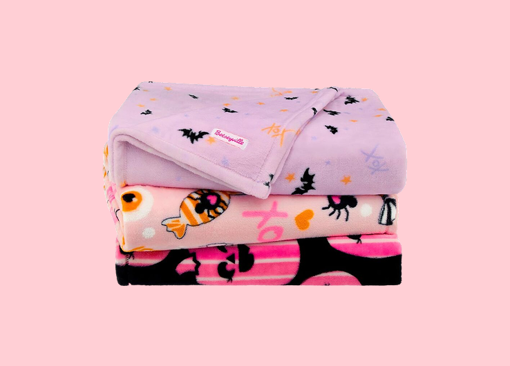 Betseyville Halloween-themed blankets with bats, candy and seasonal patterns