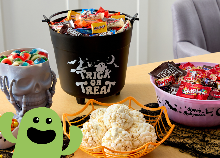 Halloween candy and treats in jack-o'-lantern bucket for trick-or-treating