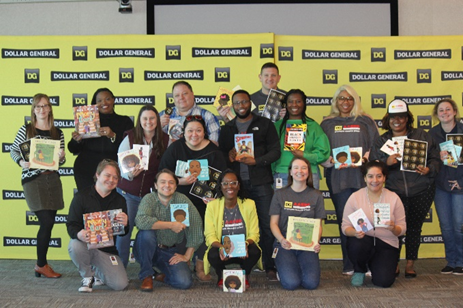 DG employees holding books